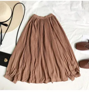 Detail view of a vintage brown pleated long-sleeve chiffon blouse with a loose fit