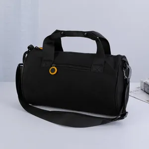 Black cylindrical multi-functional sports gym bag with shoulder strap