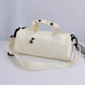 Versatile beige canvas cylindrical duffel bag for gym, yoga, and travel with handles