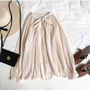 Elegant pleated chiffon blouse with bow-tie V-neck and vintage long sleeves in beige