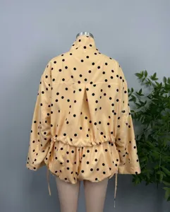 Back view of yellow polka dot jacket and shorts set with drawstring waist detail