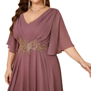Elegant plus-size mauve V-neck evening dress with gold floral embroidery and ruffle sleeves.