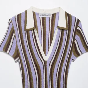 Stylish vertical striped short sleeve knit dress featuring a polo collar and V-neckline