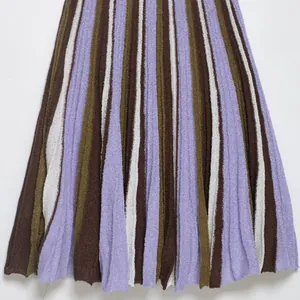 Fashionable striped knit dress featuring purple, brown, and olive vertical pleats