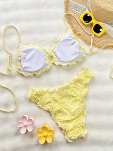 Detailed view of yellow ruffle bikini set with textured fabric and soft inner lining