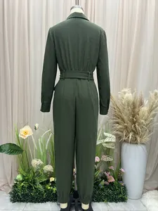 Detailed back view of a dark green long-sleeved jumpsuit with a waist belt and lapel collar