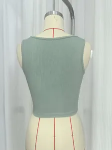 Back detail of a sage green ribbed knit crop tank top shown on a white mannequin.