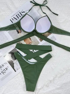 Detail view of olive green solid color bikini set with high-waist criss-cross bottom