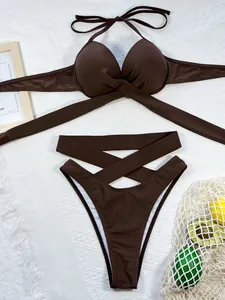 Detailed view of brown bikini set featuring cross-strap top and high-waisted bottom