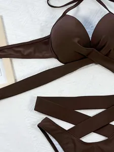 Close-up detail of brown solid bikini set with criss-cross straps and padded cups