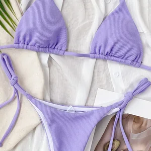 Close-up of lavender ribbed bikini showing detailed fabric texture and tie-side straps