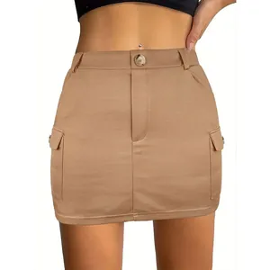 Close-up front view of khaki cargo mini skirt featuring large flap side pockets