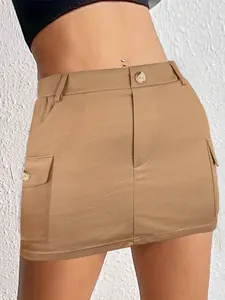 Close-up detail of a women's khaki knitted cargo mini skirt with large side pockets.