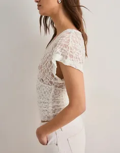 Side view of elegant white floral lace Y2K sheer mesh short sleeve top for women
