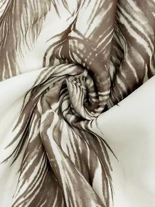 Detailed close-up of lightweight fabric with Bohemian brown feather print design