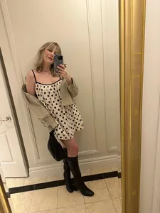 Stylish women's summer polka dot mini dress with thin straps and a khaki casual jacket