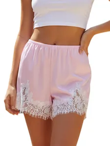 Stylish pink satin wide-leg shorts featuring intricate white lace trim hem