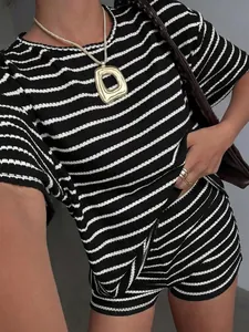 Close-up of textured black and white striped fabric on women's summer two-piece set