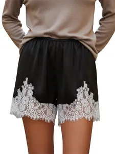 Elegant black satin shorts featuring delicate white lace trim for stylish women fashion