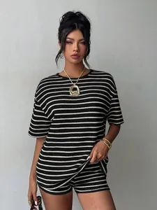 Stylish black and white striped two-piece summer set with short sleeves and matching shorts
