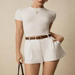 Detailed view of high-waisted pleated wide-leg dress shorts with a stylish brown belt