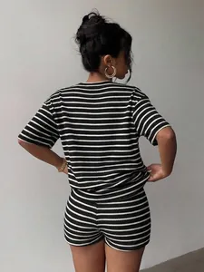 Back view of a women's casual two-piece set with black and white horizontal stripes