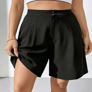 Detail view of high-waisted black wide-leg dress shorts for women's office wear.
