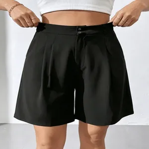 Detail view of women's black high-waisted wide-leg suit shorts for casual office wear