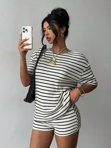 Chic model wearing a black and white striped short sleeve t-shirt and shorts casual set