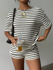 Detail view of a chic striped knit two-piece set with short sleeve top and casual shorts