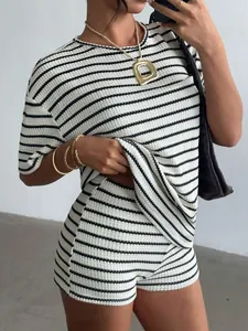 Close-up detail showing the textured knit and horizontal stripes of the casual set