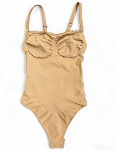 Close-up of nude lace bodysuit shapewear with adjustable straps and thong bottom.