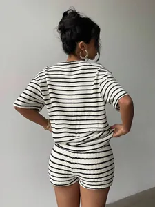 Back view of a chic black and white striped two-piece waffle knit set for women.