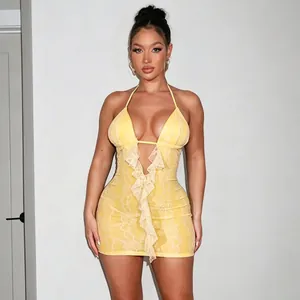 Detailed view of a sexy yellow lace halter mini dress featuring elegant ruffle details