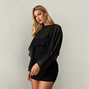 Elegant solid black mini dress featuring a sheer mesh long-sleeve shawl overlay.