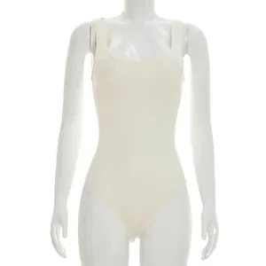 Detail view of a cream-colored sleeveless slim bodysuit on a white display mannequin