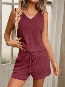 A stylish two-piece burgundy ribbed knit lounge set featuring a V-neck tank and shorts
