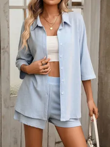 Close-up of blue and white striped shirt and shorts set for casual summer wear