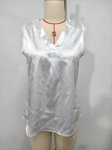 Close-up of white V-neck sleeveless satin blouse for women displayed on a torso mannequin