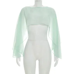Macro view of a light green sheer chiffon long sleeve shrug shawl on white mannequin