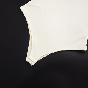 Close-up detail showing the snap closure of a cream sleeveless mesh bodysuit