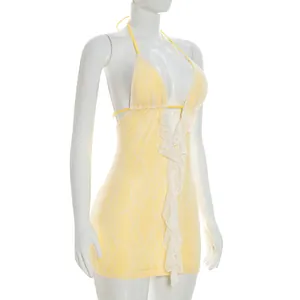 Sexy yellow lace mini dress featuring ruffles and a backless halter design for summer.
