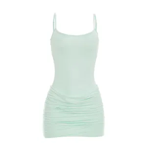 Detailed close-up of a mint green ruched mesh bodycon mini dress with spaghetti straps