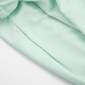 Detailed close-up showing the soft mint green mesh fabric and fine ribbed knit texture