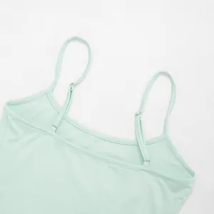 Detailed close-up showing the adjustable thin straps of a mint green casual camisole dress