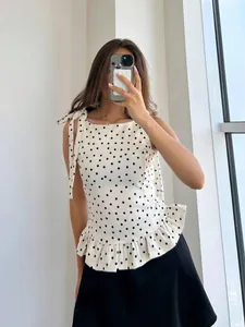 Elegante top peplum sin mangas de lunares con lazos ajustables en los hombros para mujer