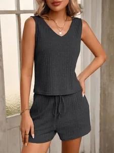 Detailed view of women's dark grey ribbed V-neck sleeveless tank top and shorts loungewear set.