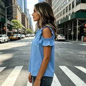 Side profile of a blue cold-shoulder chiffon top with elegant ruffle sleeve detail