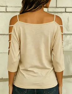 Back view detail of beige cold-shoulder t-shirt with cutout sleeve design
