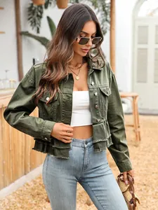 Close-up of army green denim jacket with layered ruffled hem and frayed edges style.
